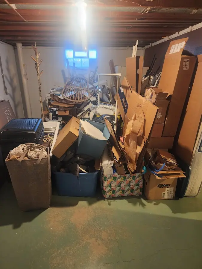 Roll-off dumpster container at job site for Yard Waste Dumpster Rental in Fort Fairfield